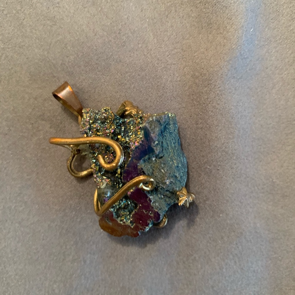 Hand wrapped in gold green/purple pendant